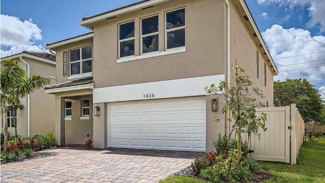 Representative exterior photo of a completed home built from the Grandcourt by D.R. Horton in Parker Pointe, Homestead, FL (Image 19).