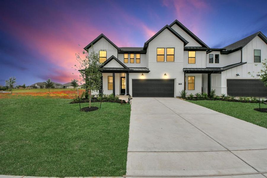 Front exterior of a new home in Elyson: Elyson Duets, Katy, TX, highlighting curb appeal (Image 1). Front exterior of a new home in Elyson: Elyson Duets, Katy, TX, highlighting curb appeal (Image 1).