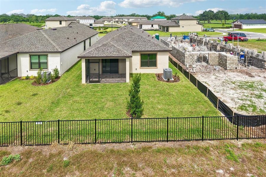 Exterior details and patio area of a home in Grasslands West, Lakeland (Image 4).