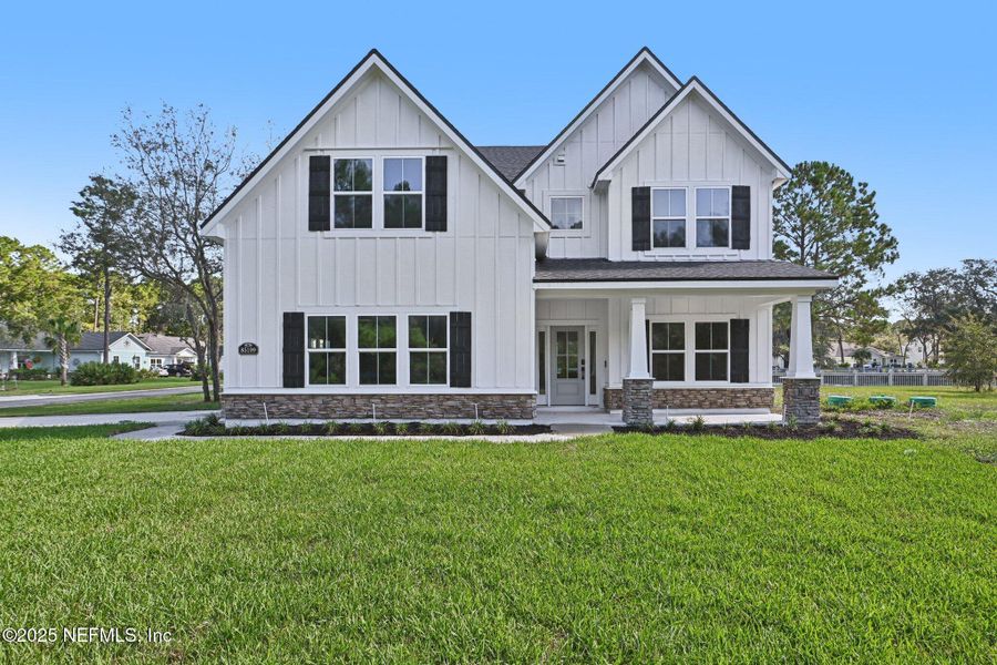 Front exterior of a new home in , Fernandina Beach, FL, highlighting curb appeal (Image 1).