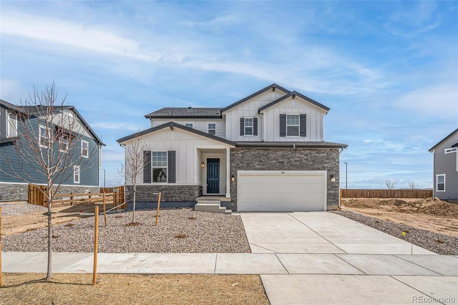 Front exterior of a new home in , Commerce City, CO, highlighting curb appeal (Image 2).