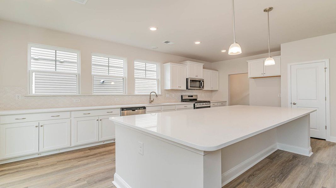 Representative furnished interior of a home built from the FORRESTER by D.R. Horton in Shell Pointe, Gilbert (Image 7).