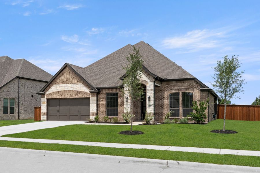Front exterior of a new home in Lovers Landing, Forney, TX, highlighting curb appeal (Image 2). Front exterior of a new home in Lovers Landing, Forney, TX, highlighting curb appeal (Image 2).