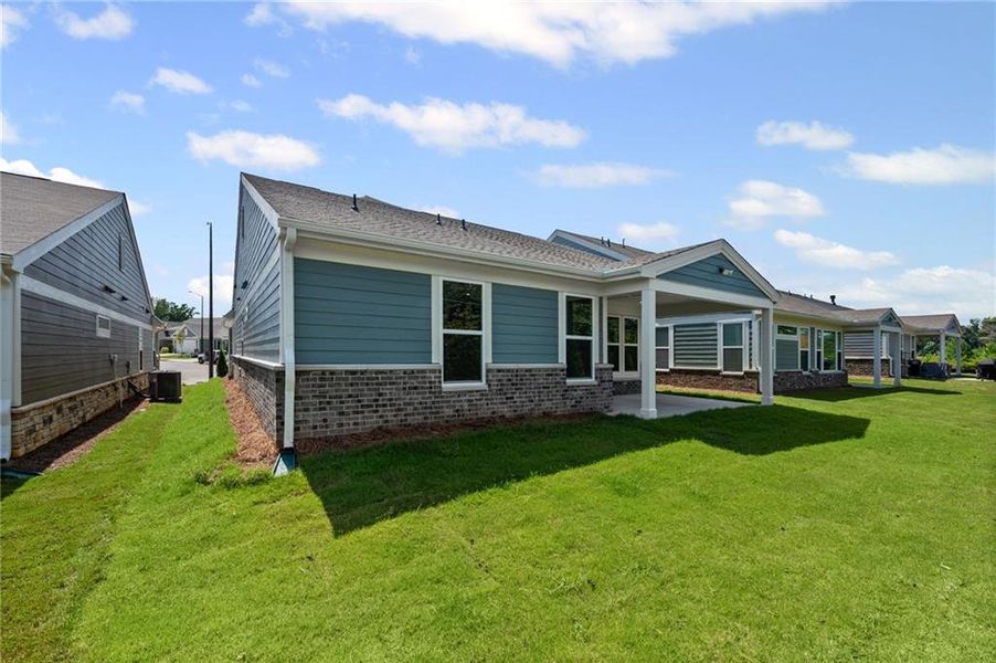 Front exterior of a new home in Laurel Farms, Dallas, GA, highlighting curb appeal (Image 2).