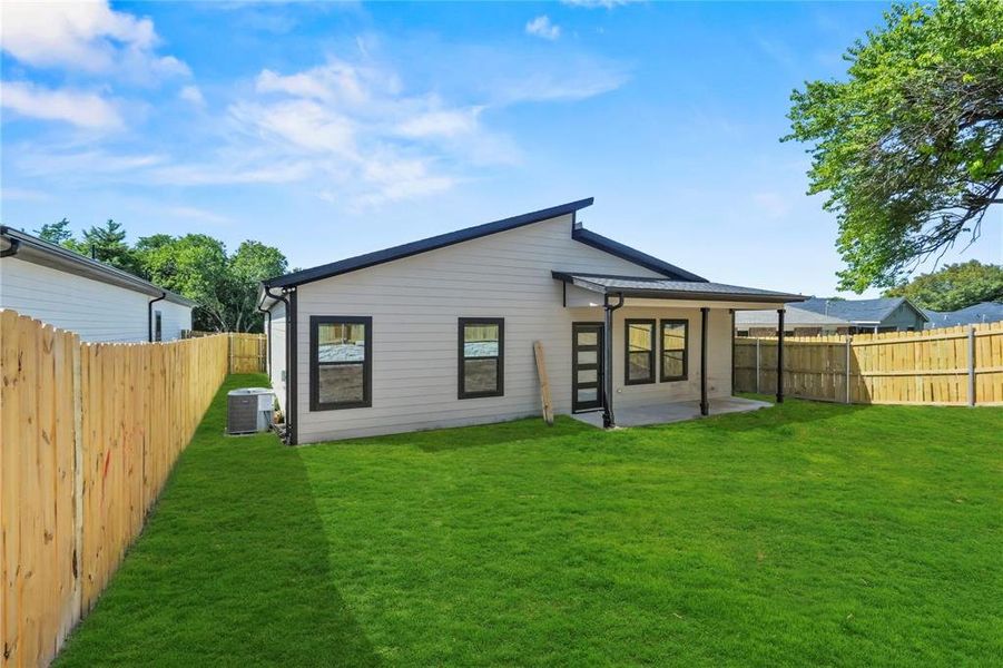 Rear view of property featuring a patio and a fenced backyard Rear view of property featuring a patio and a fenced backyard