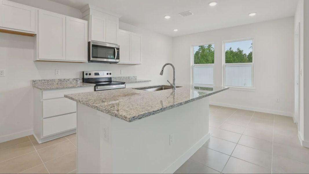 Kitchen of the Coronado - End at Cyrene at Harmony located in St Cloud FL by DRB Homes