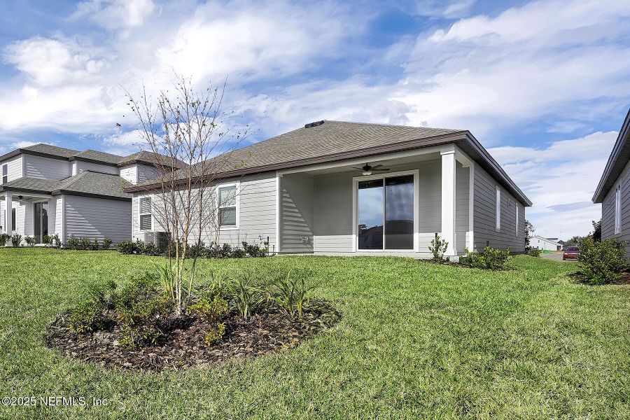 Front exterior of a new home in Jennings Farm, Middleburg, FL, highlighting curb appeal (Image 1).