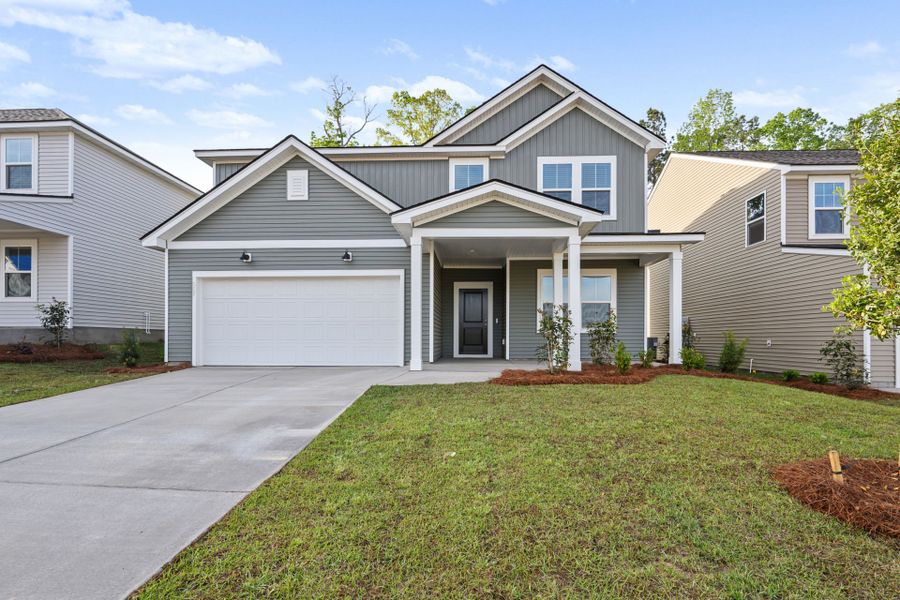 Front exterior of a new home in Grand Arbor, Blythewood, SC, highlighting curb appeal (Image 22).
