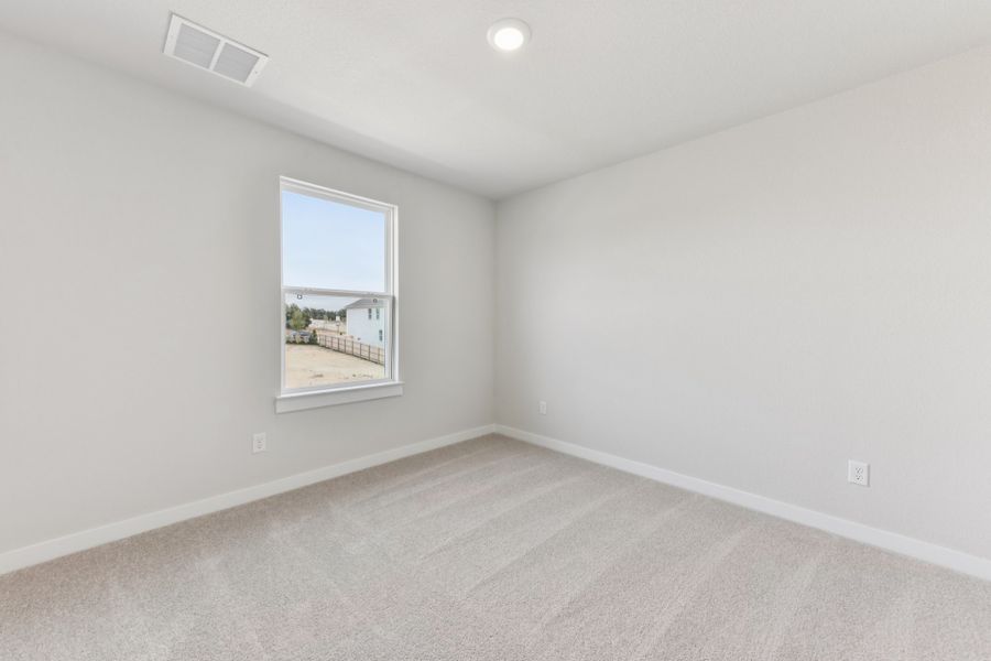 A room with a window and a white wall. A room with a window and a white wall.