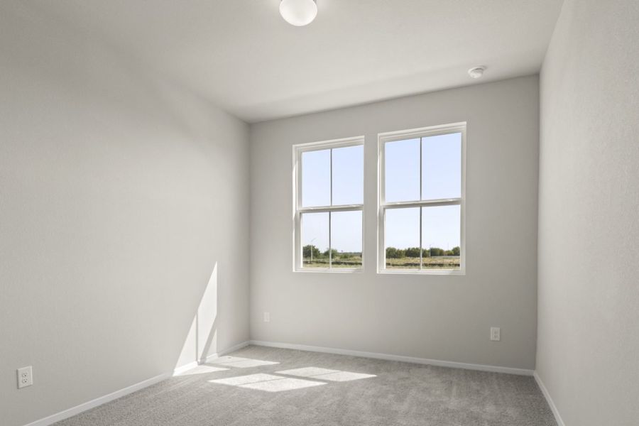 Image of home secondary befroom with light carpet, white walls, and two windows