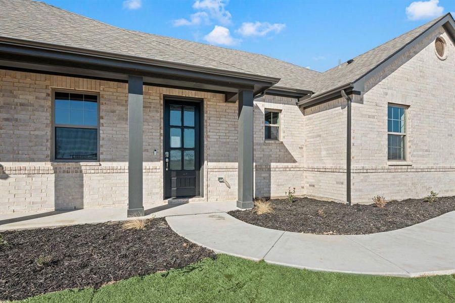 Front exterior of a new home in Saddleback Estates, Boyd, TX, highlighting curb appeal (Image 2).