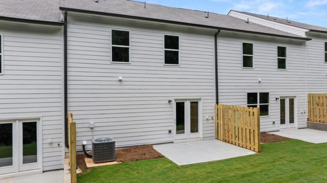 Exterior details and patio area of a home in Waypoint, Flowery Branch (Image 3).