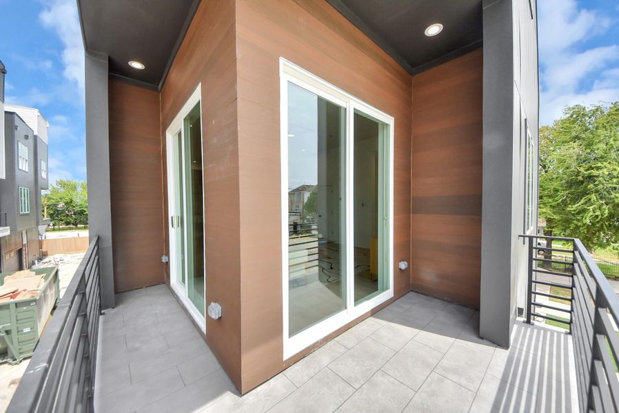 Covered balcony accessible from the second-floor living room.