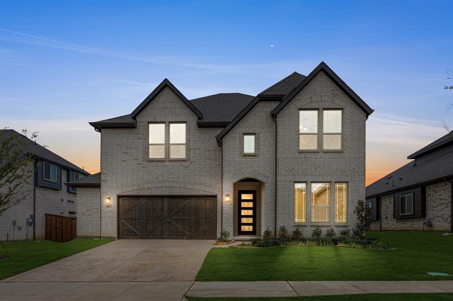 Front exterior of a new home in Windsong Ranch Classic 61, Prosper, TX, highlighting curb appeal (Image 1).