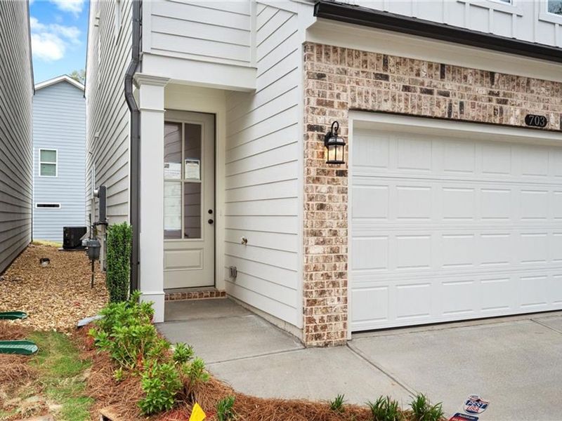 Exterior details and patio area of a home in The Village at Shallowford, Kennesaw (Image 1).