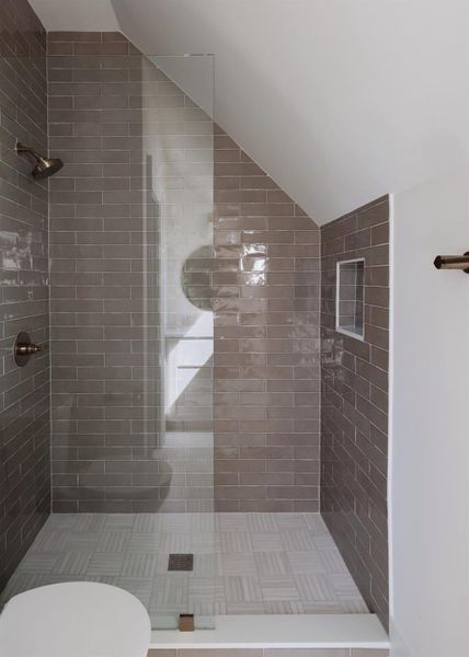 Third floor shower is part of the full bath that serves the third floor bedroom.