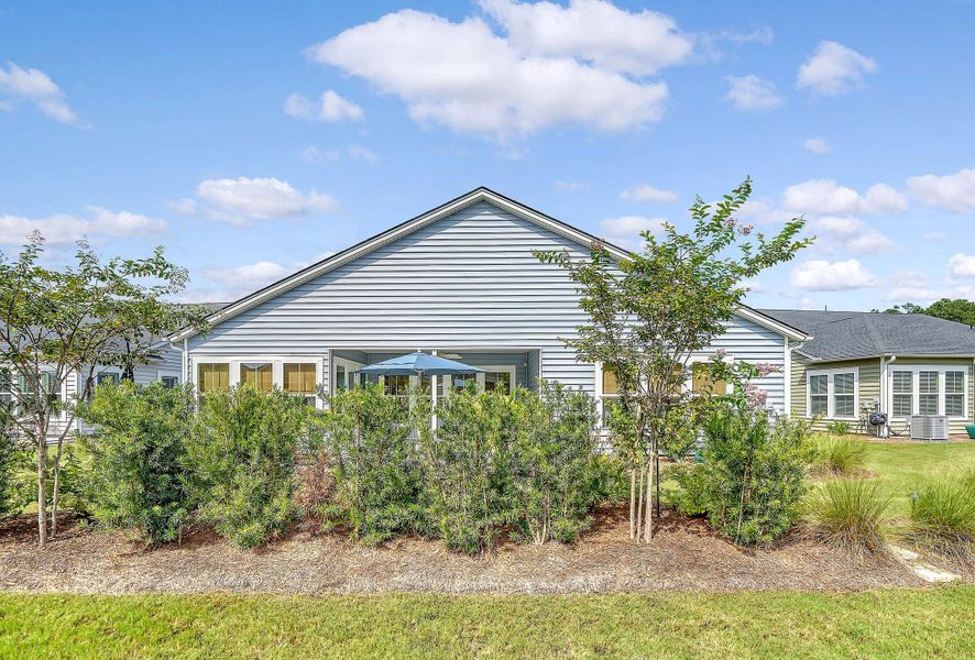 Front exterior of a new home in Horizons at Summers Corner | 55+: The Estates, Summerville, SC, highlighting curb appeal (Image 33).