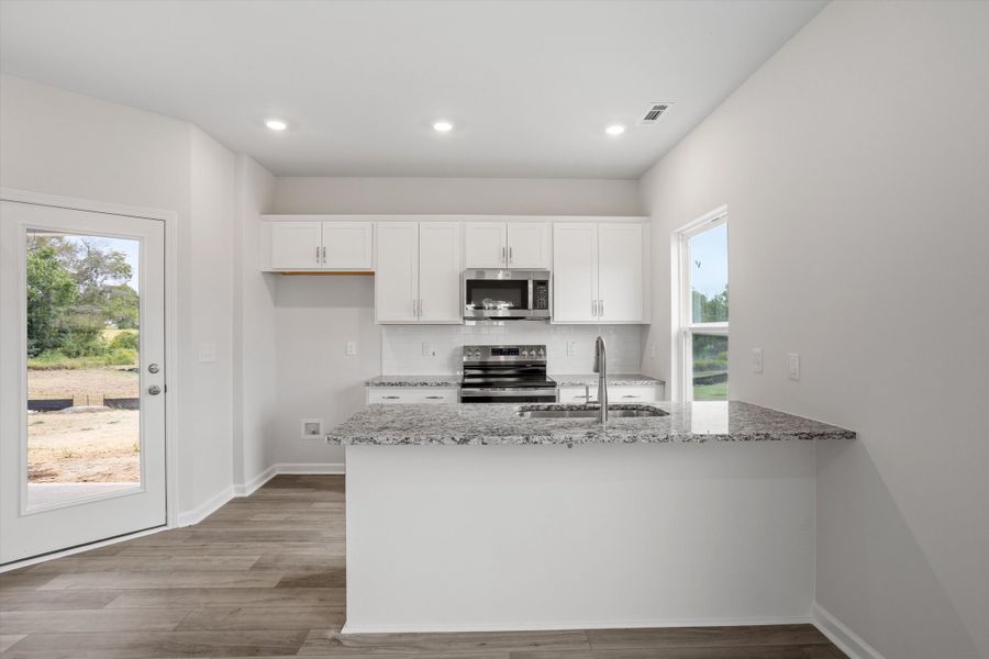 Furnished interior view inside a new home in Cambridge Reserve, Angier (Image 6).