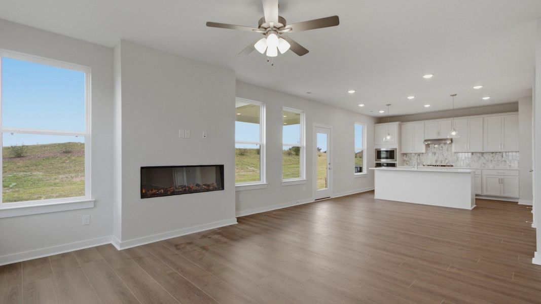 natural light fills the spacious living area next to the kitchen natural light fills the spacious living area next to the kitchen
