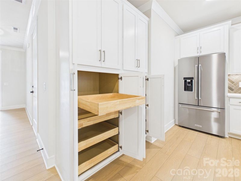 Pantry with roll out shelves to maximize storage space