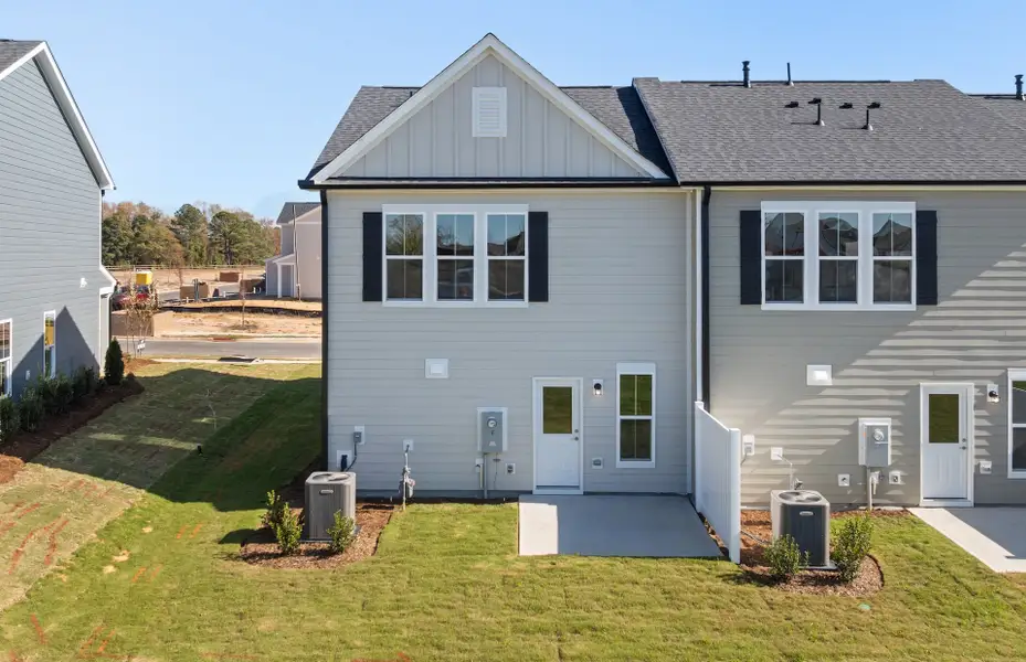 Exterior details and patio area of a home in Saunders Farm, Willow Spring (Image 3).
