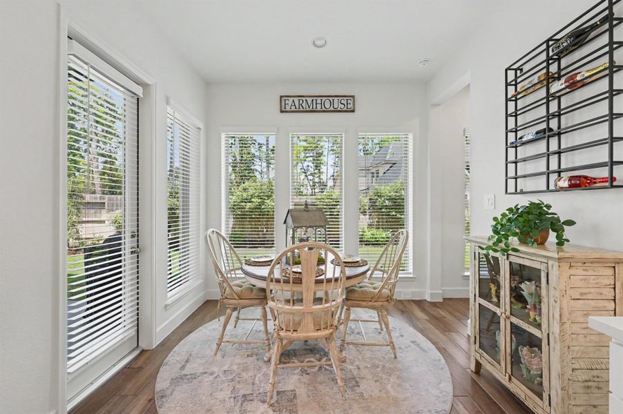 This cozy spot is perfect for casual dining and is filled with natural light. Surrounded by windows and the perfect spot was enjoying the beautifully landscaped backyard while in the A/C. This cozy spot is perfect for casual dining and is filled with natural light. Surrounded by windows and the perfect spot was enjoying the beautifully landscaped backyard while in the A/C.