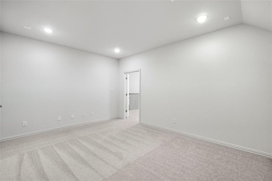 Empty room featuring light colored carpet and recessed lighting Empty room featuring light colored carpet and recessed lighting