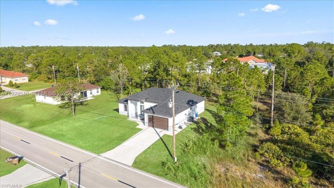 Front exterior of a new home in , Lehigh Acres, FL, highlighting curb appeal (Image 20).