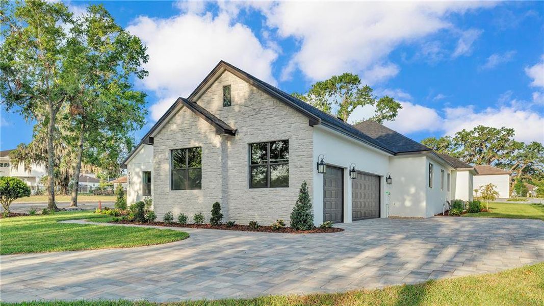 Front exterior of a new home in , Lakeland, FL, highlighting curb appeal (Image 23). Front exterior of a new home in , Lakeland, FL, highlighting curb appeal (Image 23).