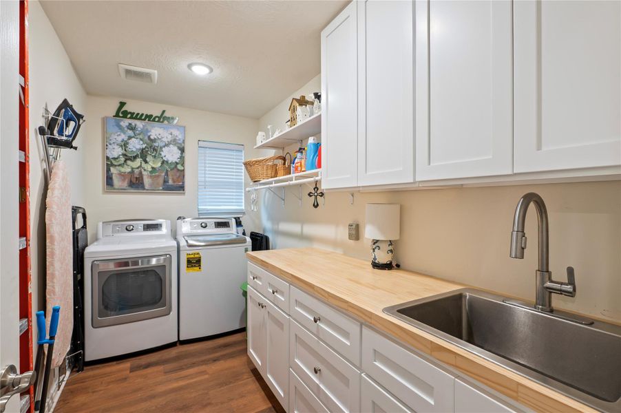 Laundry with upgraded full sink, countertops and cabinets Laundry with upgraded full sink, countertops and cabinets