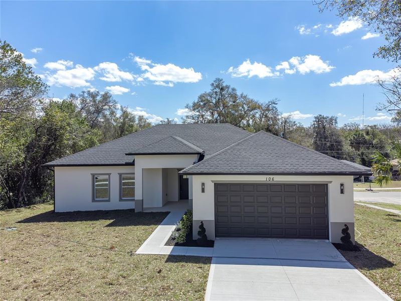 Front exterior of a new home in , Orange City, FL, highlighting curb appeal (Image 31).