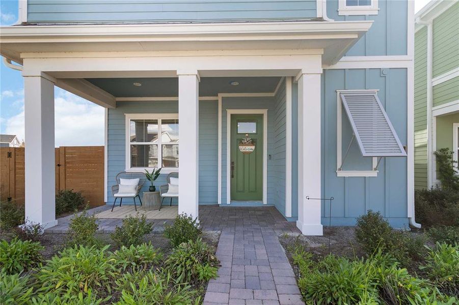 Exterior details and patio area of a home in Weslyn Park at Sunbridge (Craft Homes), St. Cloud (Image 3).