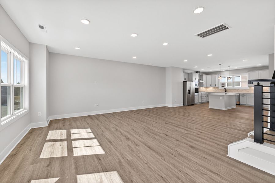 Representative unfurnished interior of a home built from the Atlas Interior Unit by Baker Residential in Atwater Station - Midtown Collection, Fuquay Varina (Image 26).