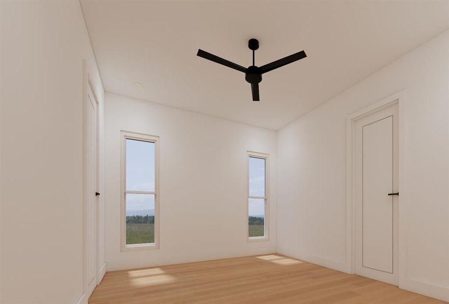 Empty room featuring ceiling fan and light wood-type flooring