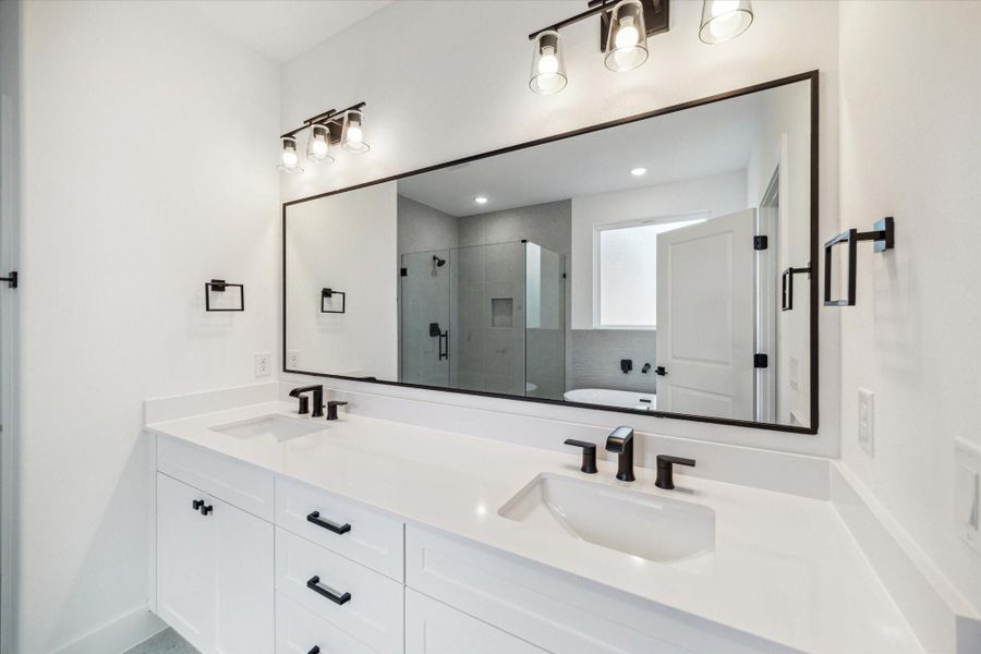 Secondary bathroom offers private vanities for each bedroom. Secondary bathroom offers private vanities for each bedroom.
