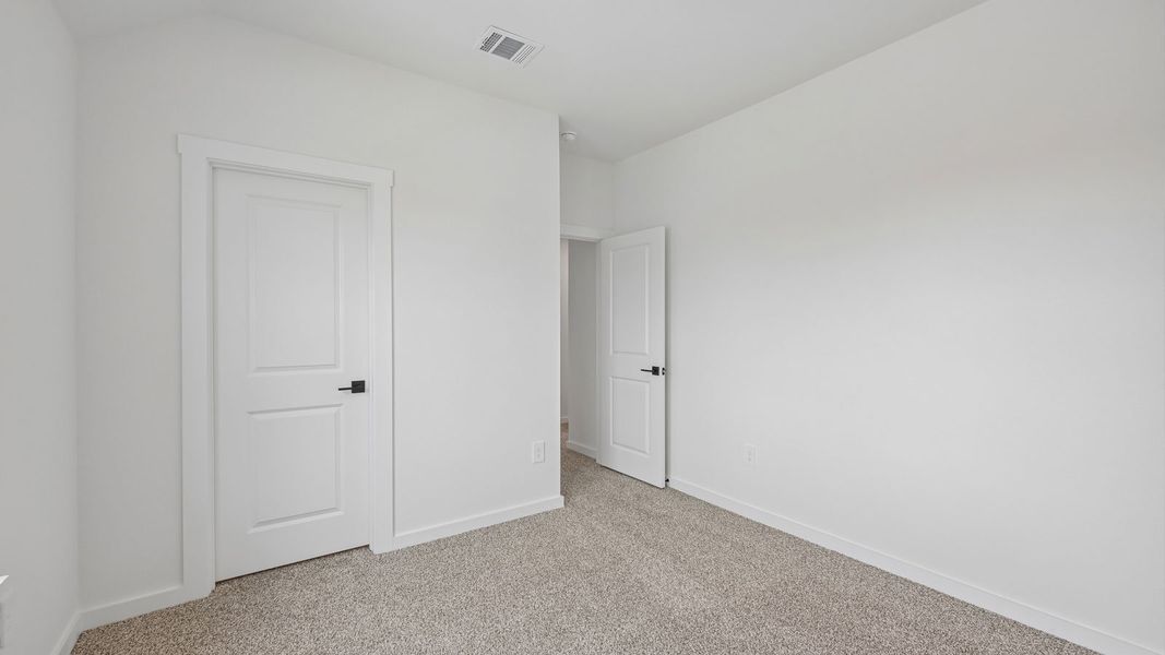 Spacious, unfurnished interior of a new home in The Enclave at Bar W Ranch, Leander (Image 33).