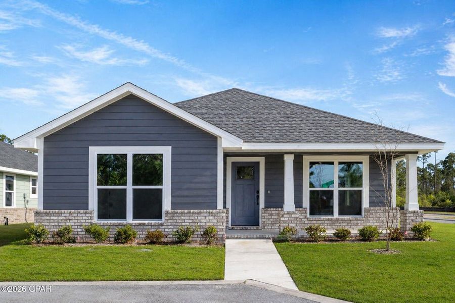 Front exterior of a new home in East Bay, Panama City, FL, highlighting curb appeal (Image 1). Front exterior of a new home in East Bay, Panama City, FL, highlighting curb appeal (Image 1).