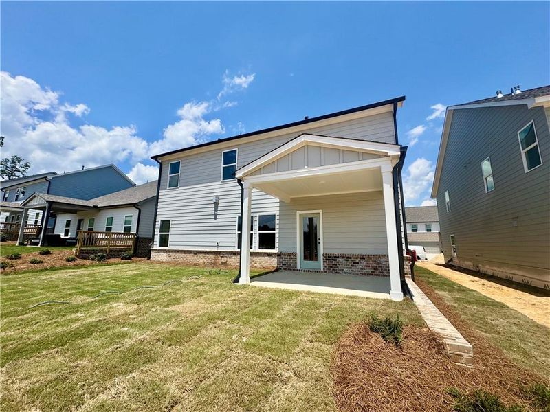 Exterior details and patio area of a home in Eastlyn Crossing, Flowery Branch (Image 3).