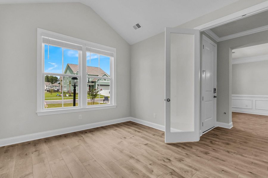 Spacious, unfurnished interior of a new home in Tidewater at Lakes of Cane Bay, Summerville (Image 13).