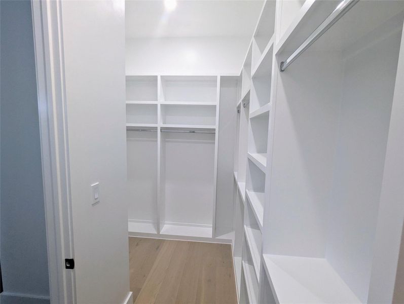 Spacious second primary closet with ample shelving and hanging space for organized storage, making sure you never run out of space. Spacious second primary closet with ample shelving and hanging space for organized storage, making sure you never run out of space.