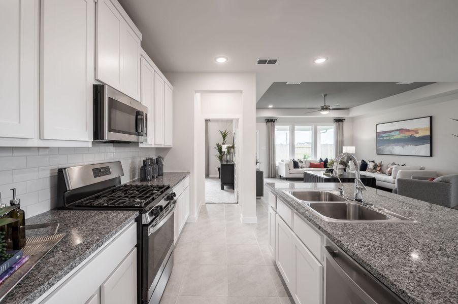 Representative furnished interior of a home built from the Caddo by Tri Pointe Homes in Mason Woods, Cypress (Image 48).