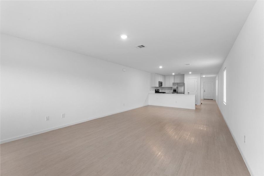Open sightline between the living room and kitchen creates an easy flow through the main living space.