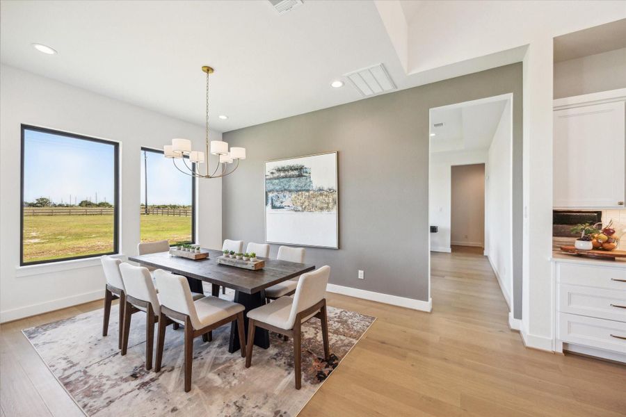 Back inside the Dining Area. Game Room/Flex Space, Powder Bath, and 2 (of 3) Secondary Bedrooms down hallway. Back inside the Dining Area. Game Room/Flex Space, Powder Bath, and 2 (of 3) Secondary Bedrooms down hallway.