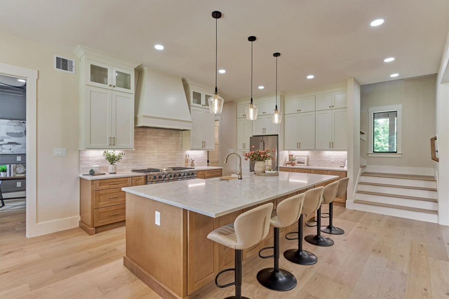 This kitchen doesn't just look good — it connects. The open sightline from the island to the stairs and living space means you're never far from the conversation, whether you're prepping dinner or keeping an eye on homework at the table. Real flow, real function, real farmhouse living. This kitchen doesn't just look good — it connects. The open sightline from the island to the stairs and living space means you're never far from the conversation, whether you're prepping dinner or keeping an eye on homework at the table. Real flow, real function, real farmhouse living.