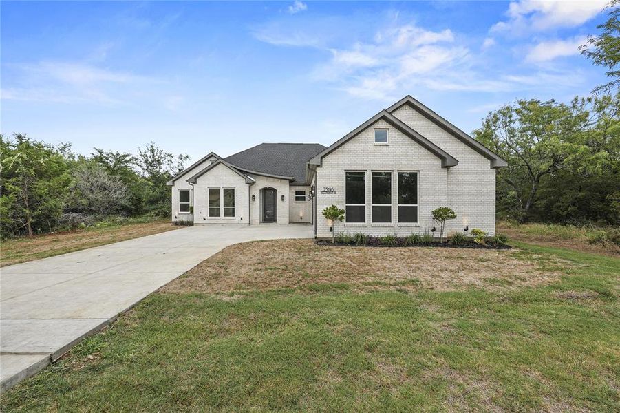 Front exterior of a new home in , Whitney, TX, highlighting curb appeal (Image 2). Front exterior of a new home in , Whitney, TX, highlighting curb appeal (Image 2).