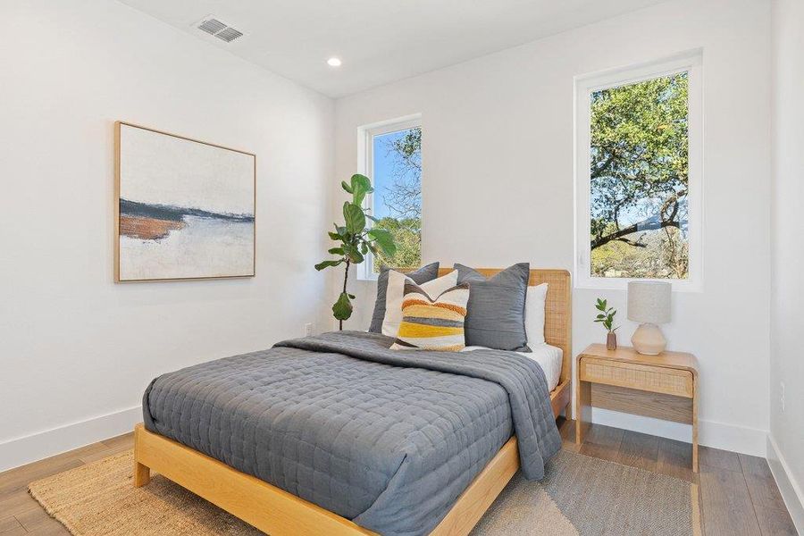 Bedroom featuring wood finished floors and recessed lighting