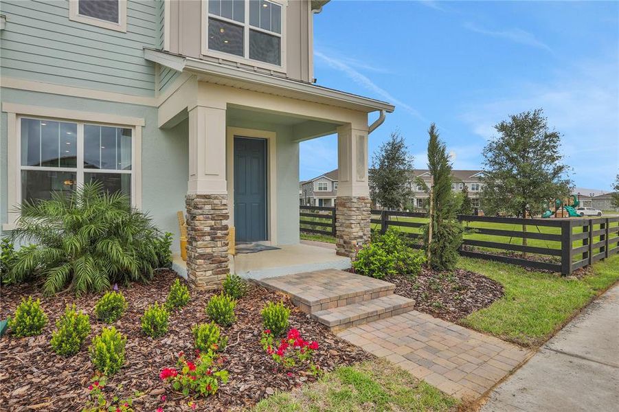 Exterior details and patio area of a home in Serenade at Ovation, Winter Garden (Image 21).