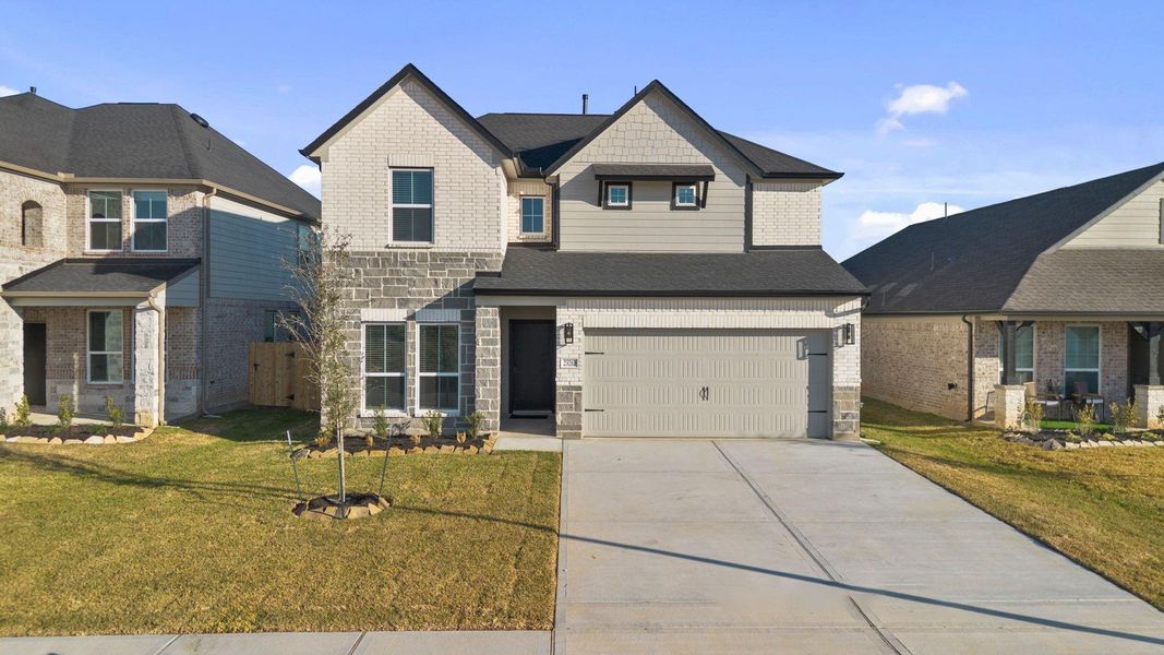 Front exterior of a new home in Morton Creek Ranch, Katy, TX, highlighting curb appeal (Image 13).