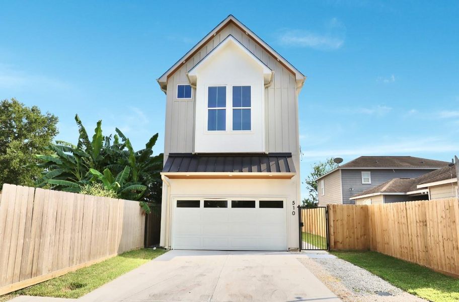 Charming curb appeal, sleek metal roof accent, a secured gated entry, and a front yard with an extended fence line for extra room. Charming curb appeal, sleek metal roof accent, a secured gated entry, and a front yard with an extended fence line for extra room.