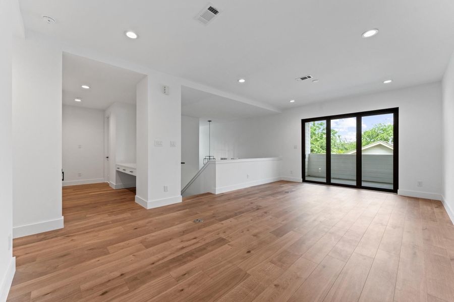 The ultimate flex space — oversized and flooded with light, ready for game nights, homework hubs, or weekend lounging.